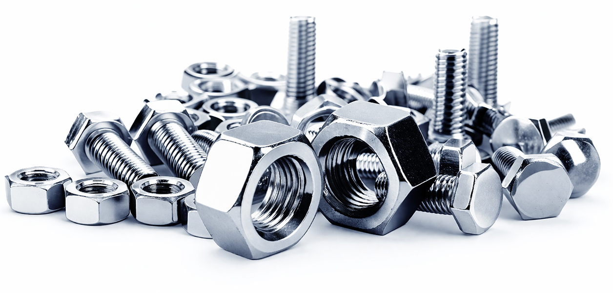 A Mixed Assortment Of Nuts And Bolts Scattered On A Clean White Surface